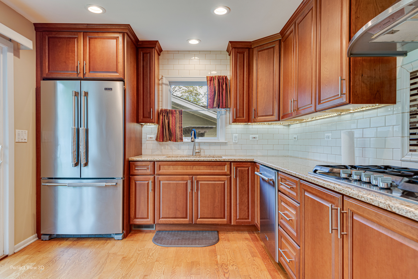 400 Illinois Road Frankfort, IL 60423 - Photo 11 of 24 a kitchen with stainless steel appliances granite countertop a refrigerator stove top oven and sink
