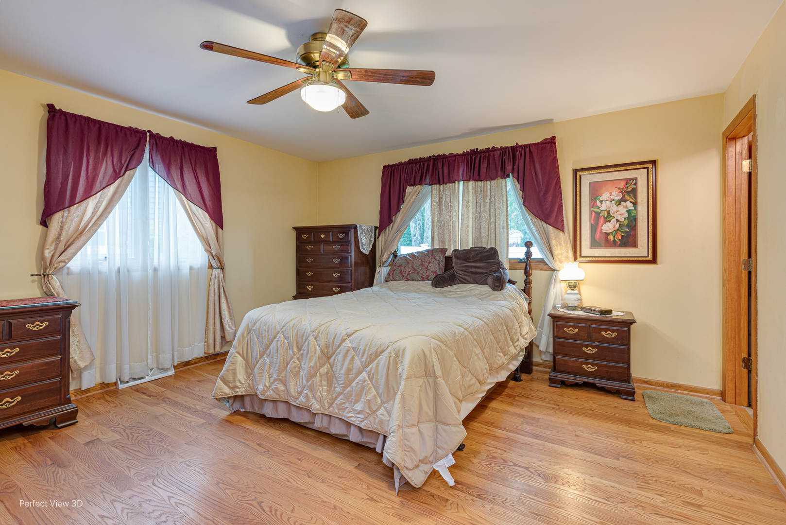 400 Illinois Road Frankfort, IL 60423 - Photo 13 of 24 a bedroom with a large bed and a chandelier