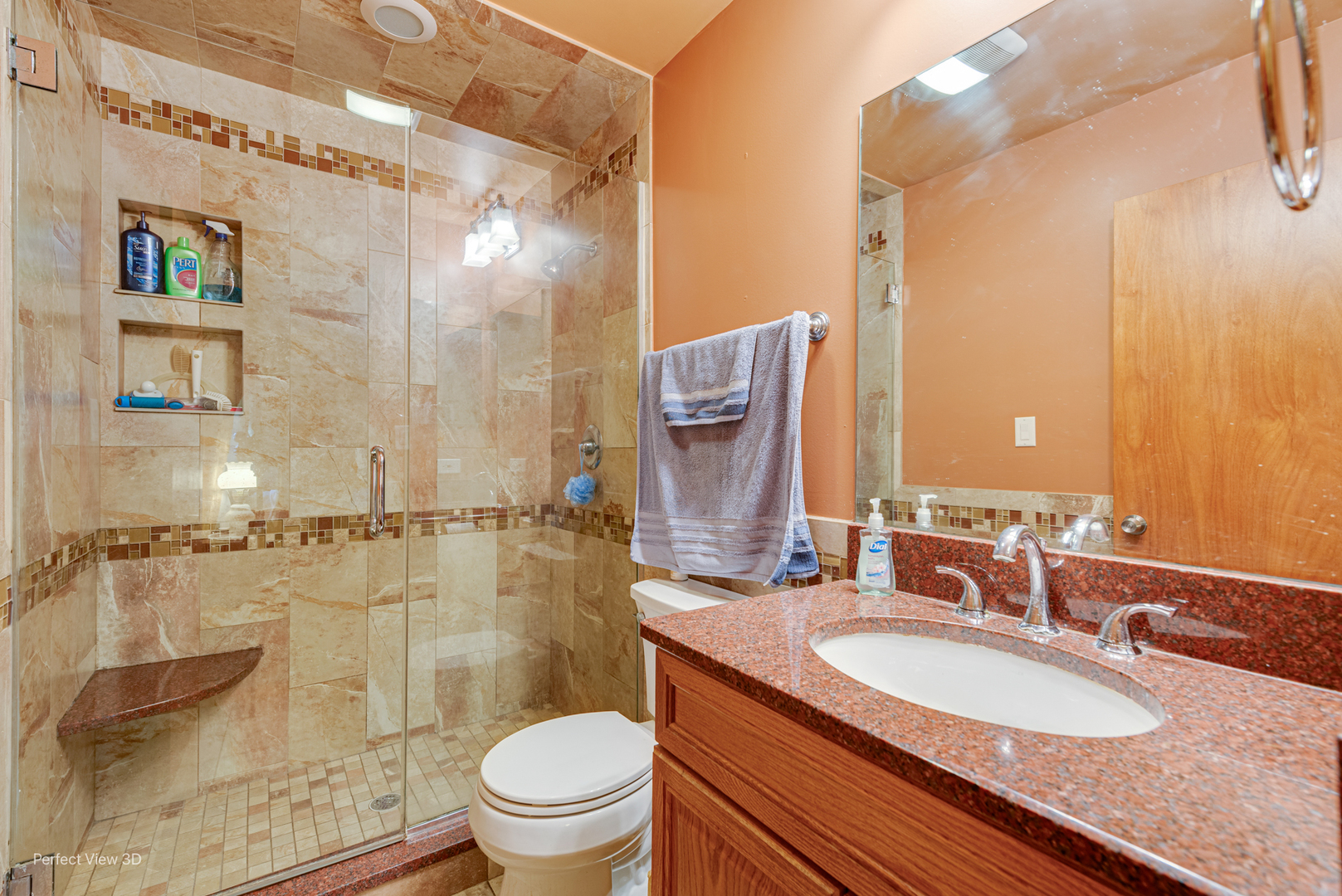 400 Illinois Road Frankfort, IL 60423 - Photo 17 of 24 a bathroom with a granite countertop sink a toilet a mirror and shower