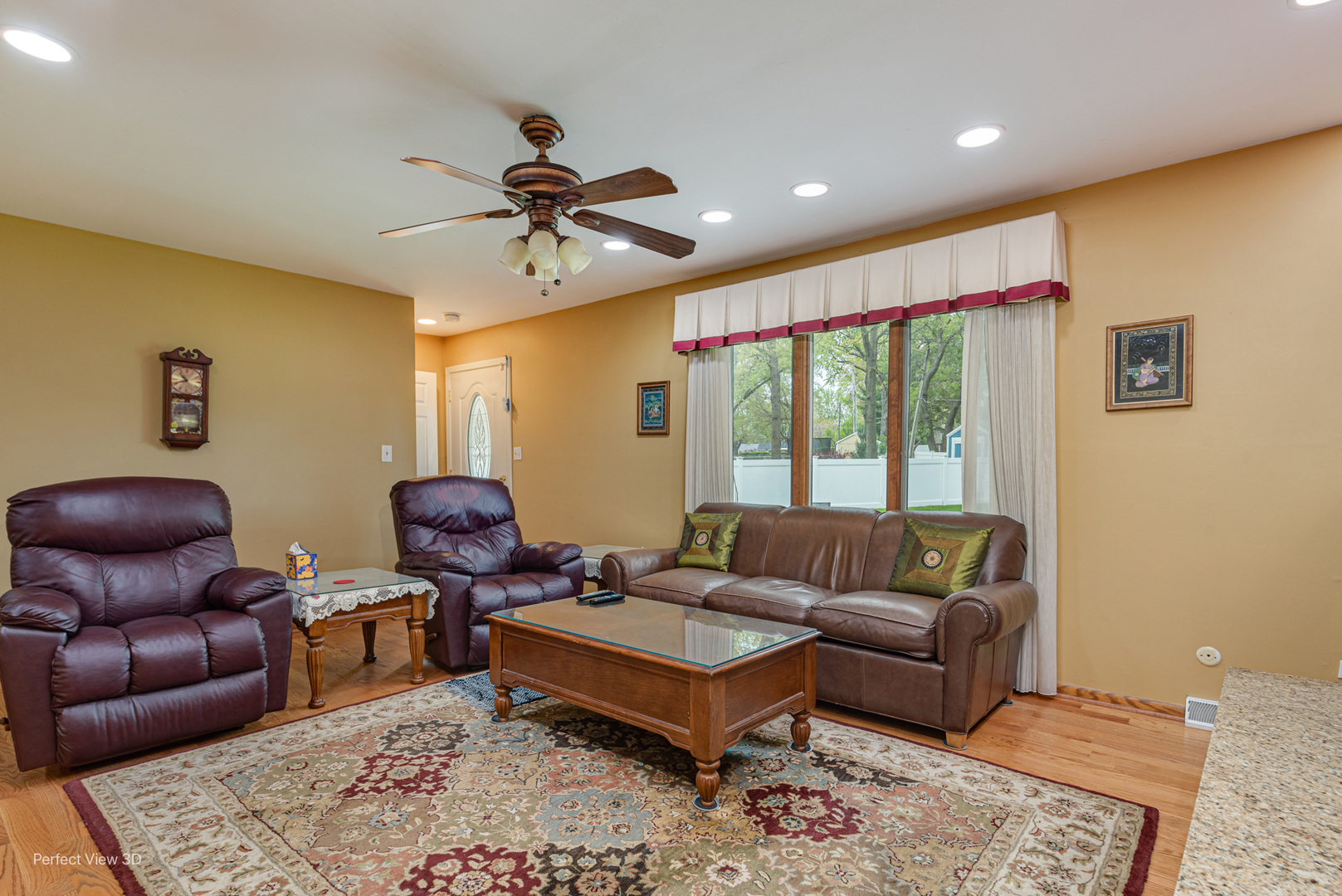 400 Illinois Road Frankfort, IL 60423 - Photo 4 of 24 a living room with furniture ceiling fan and a rug