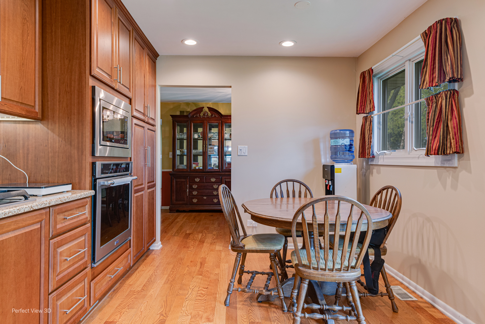 400 Illinois Road Frankfort, IL 60423 - Photo 9 of 24 a view of a dining room with furniture window and wooden floor