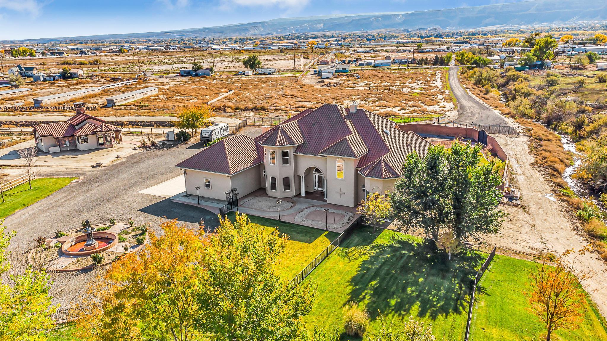 an aerial view of residential houses with outdoor space