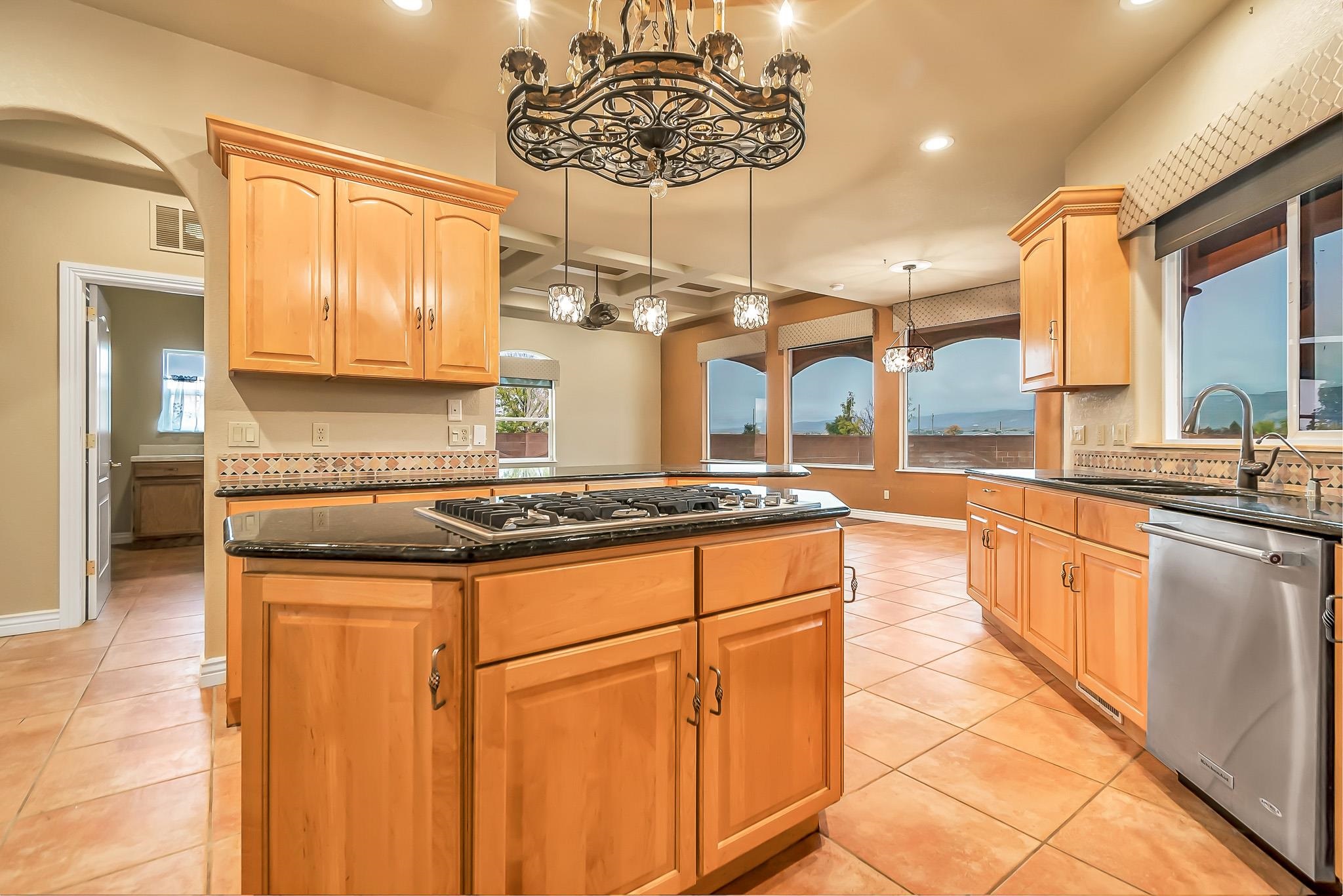 2224 H Road Grand Junction, CO 81505 - Photo 19 of 42 a kitchen with stainless steel appliances granite countertop a stove a sink and a microwave