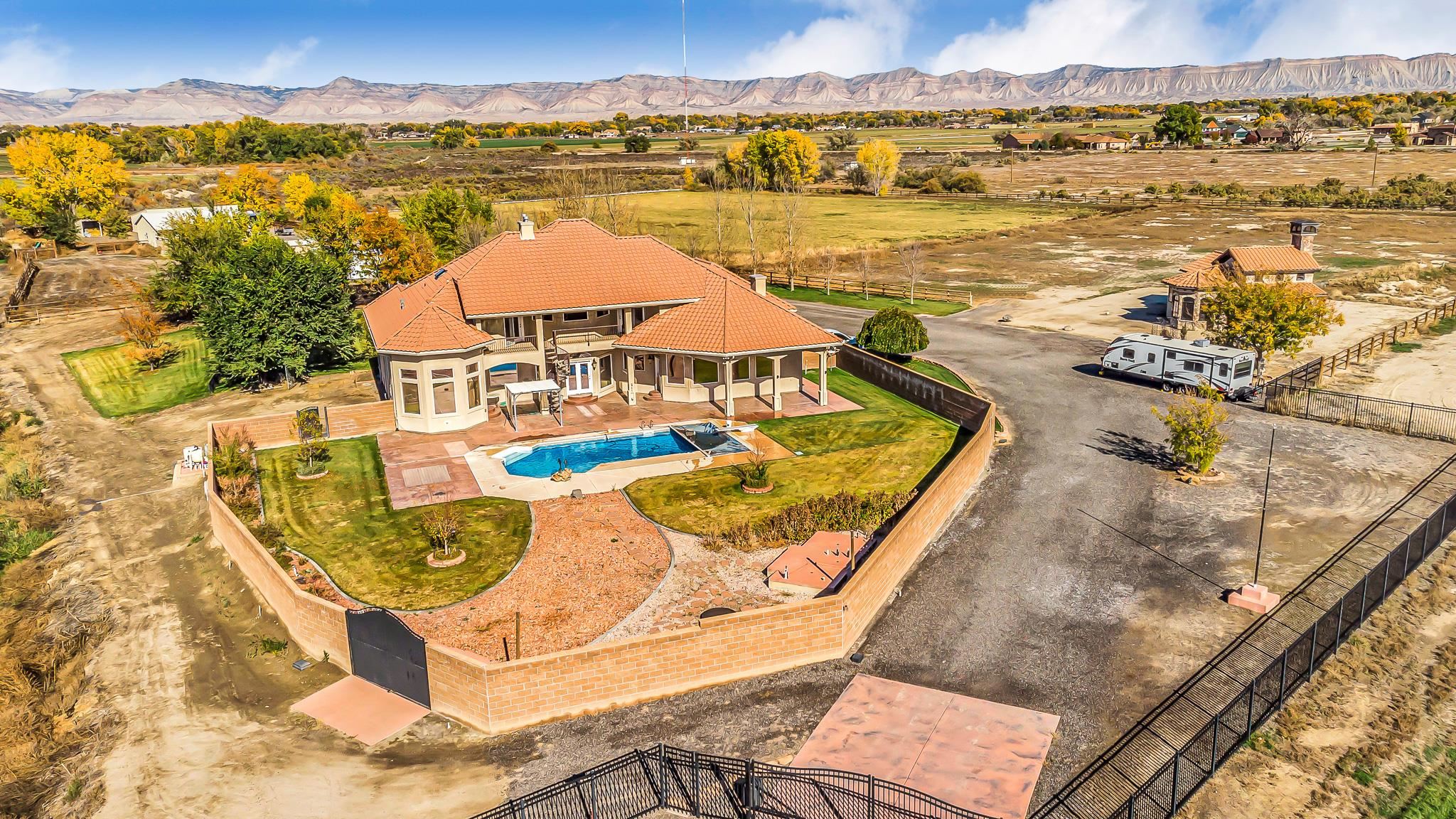 2224 H Road Grand Junction, CO 81505 - Photo 2 of 42 a view of a swimming pool with an ocean view