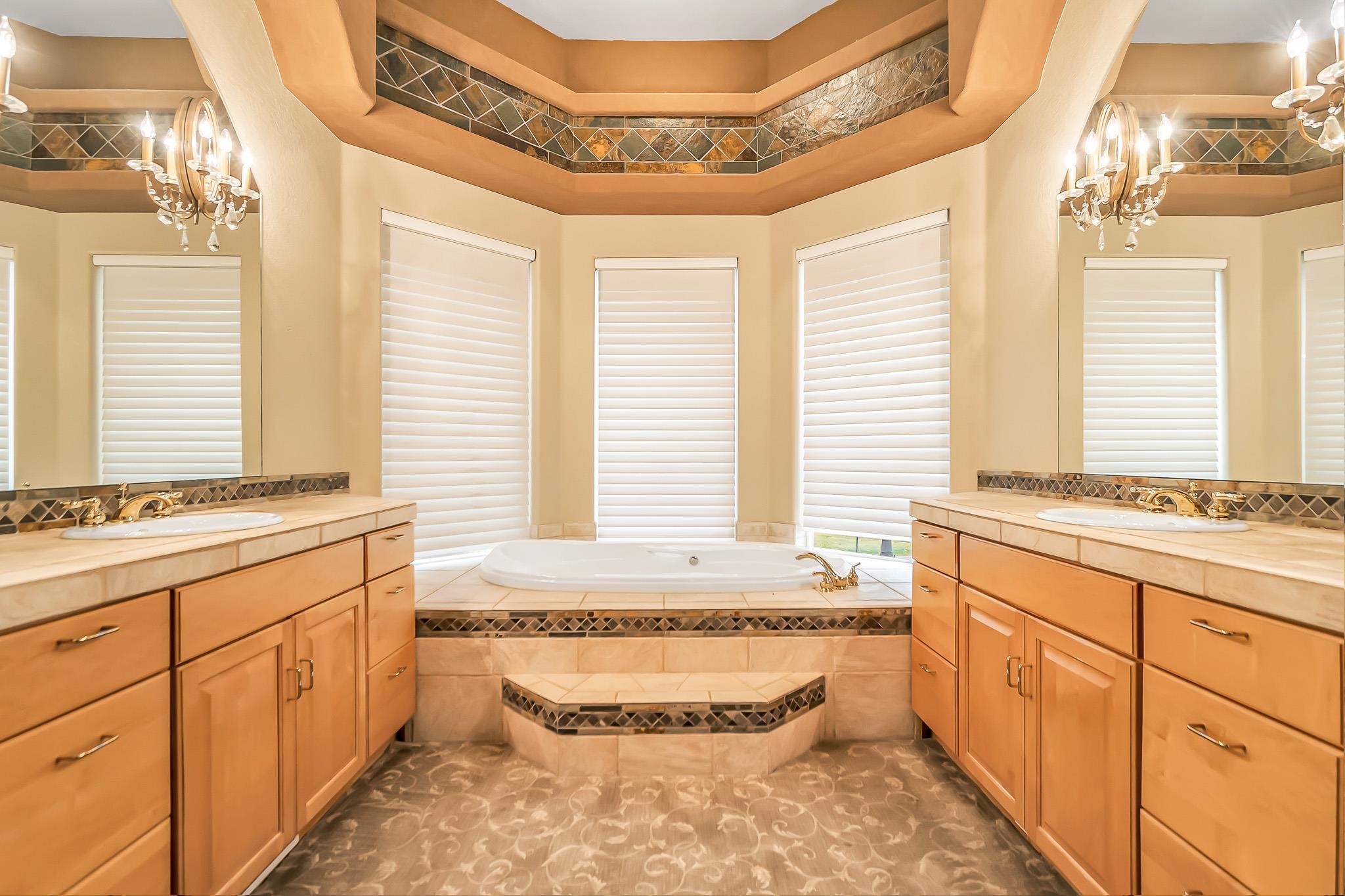 2224 H Road Grand Junction, CO 81505 - Photo 24 of 42 a bathroom with a granite countertop sink and a bathtub