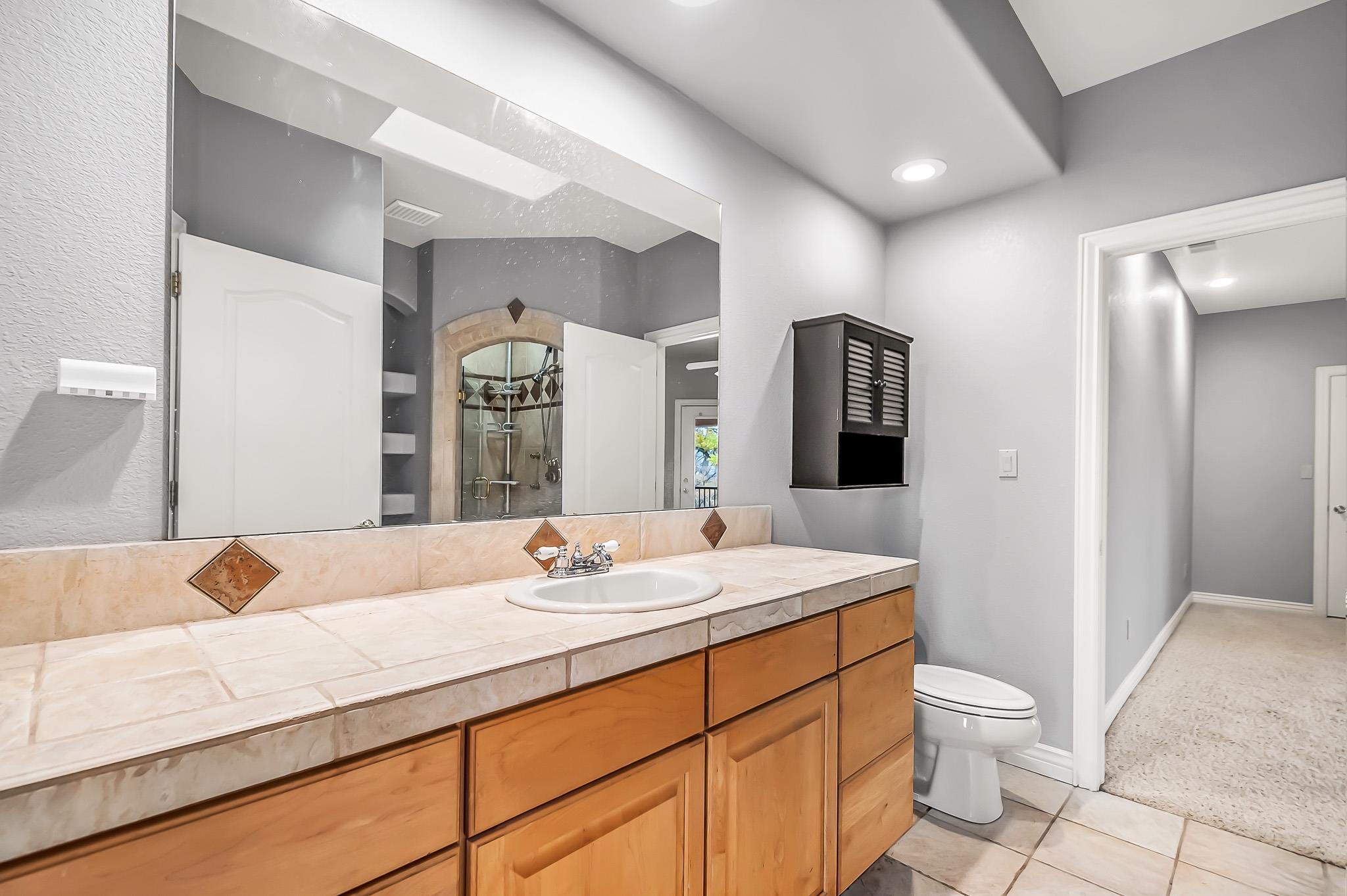 2224 H Road Grand Junction, CO 81505 - Photo 31 of 42 a bathroom with a double vanity sink and a mirror
