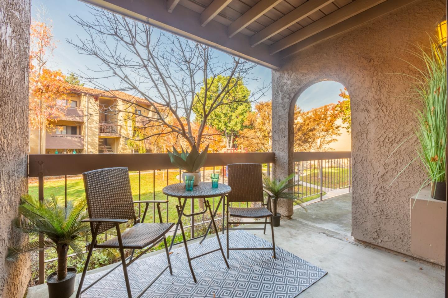2250 Monroe Street, Unit 111 Santa Clara, CA 95050 - Photo 3 of 20 a view of a porch with chairs and backyard