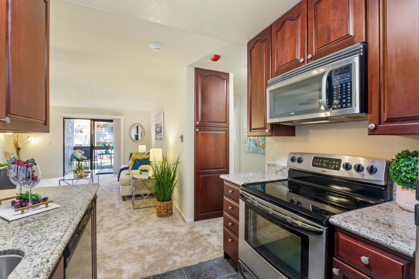 2250 Monroe Street, Unit 111 Santa Clara, CA 95050 - Photo 9 of 20 a kitchen with a stove and a microwave