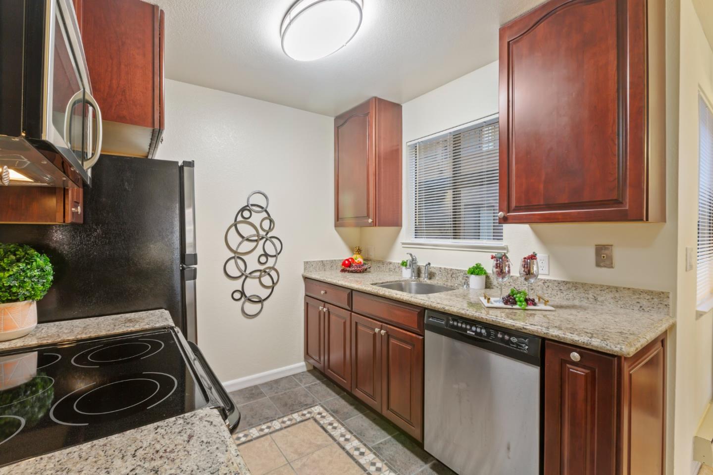 2250 Monroe Street, Unit 111 Santa Clara, CA 95050 - Photo 10 of 20 a kitchen with a sink stove and refrigerator