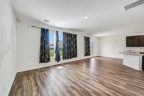 a view of an empty room and closet area