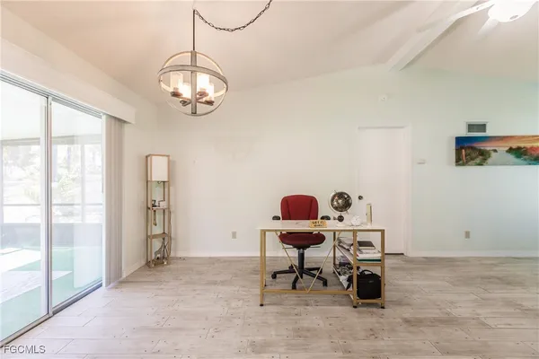 a work room with table and chairs