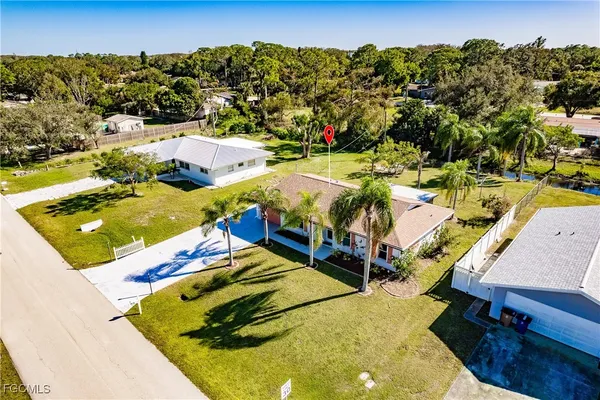 an aerial view of a house with a swimming pool