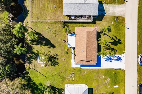 an aerial view of a house with a swimming pool