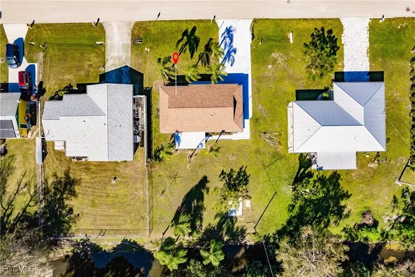 an aerial view of residential house with swimming pool