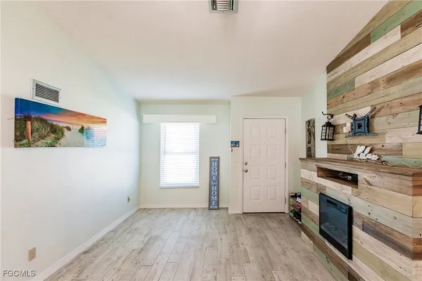 a view of a kitchen with a stove cabinets and a wooden floor