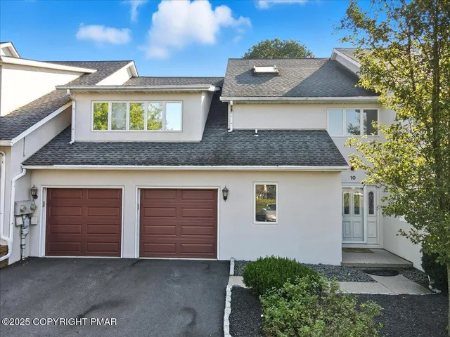 a front view of a house with yard