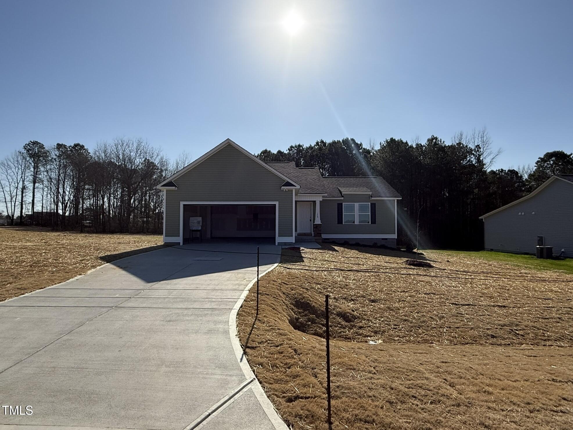 175 Magnolia Run Way Benson, NC 27504 - Photo 2 of 19 a front view of a house with a yard