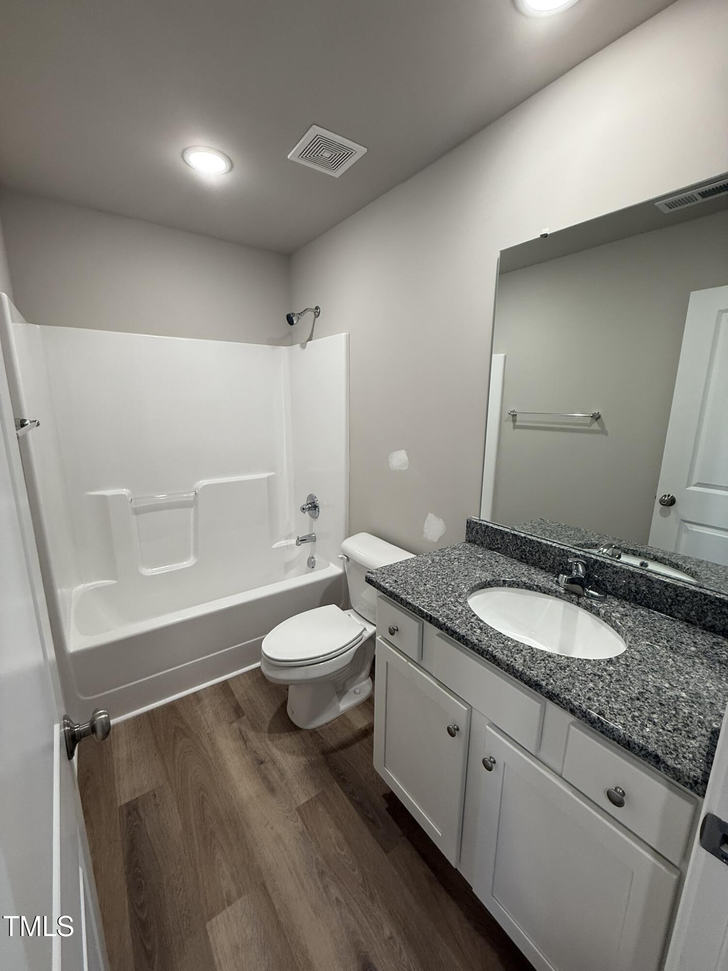 175 Magnolia Run Way Benson, NC 27504 - Photo 10 of 19 a spacious bathroom with a granite countertop sink toilet and shower
