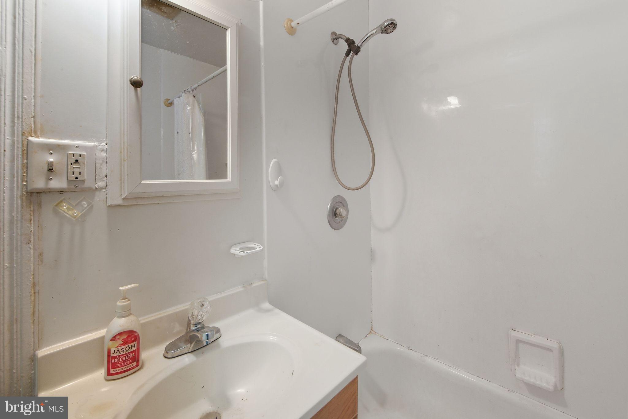 238 Highland Avenue Wayne, PA 19087 - Photo 13 of 17 a bathroom with a sink a vanity and shower