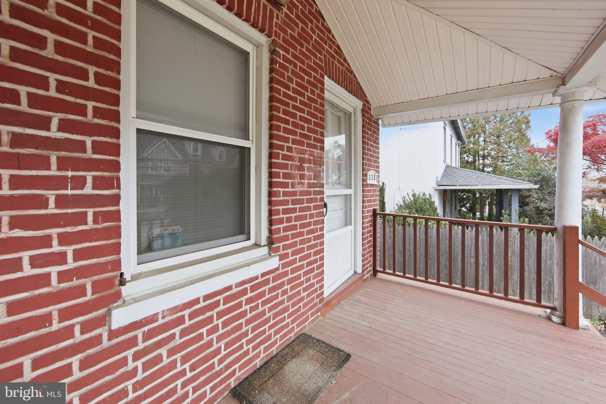 238 Highland Avenue Wayne, PA 19087 - Photo 2 of 17 a view of a brick house with a large window