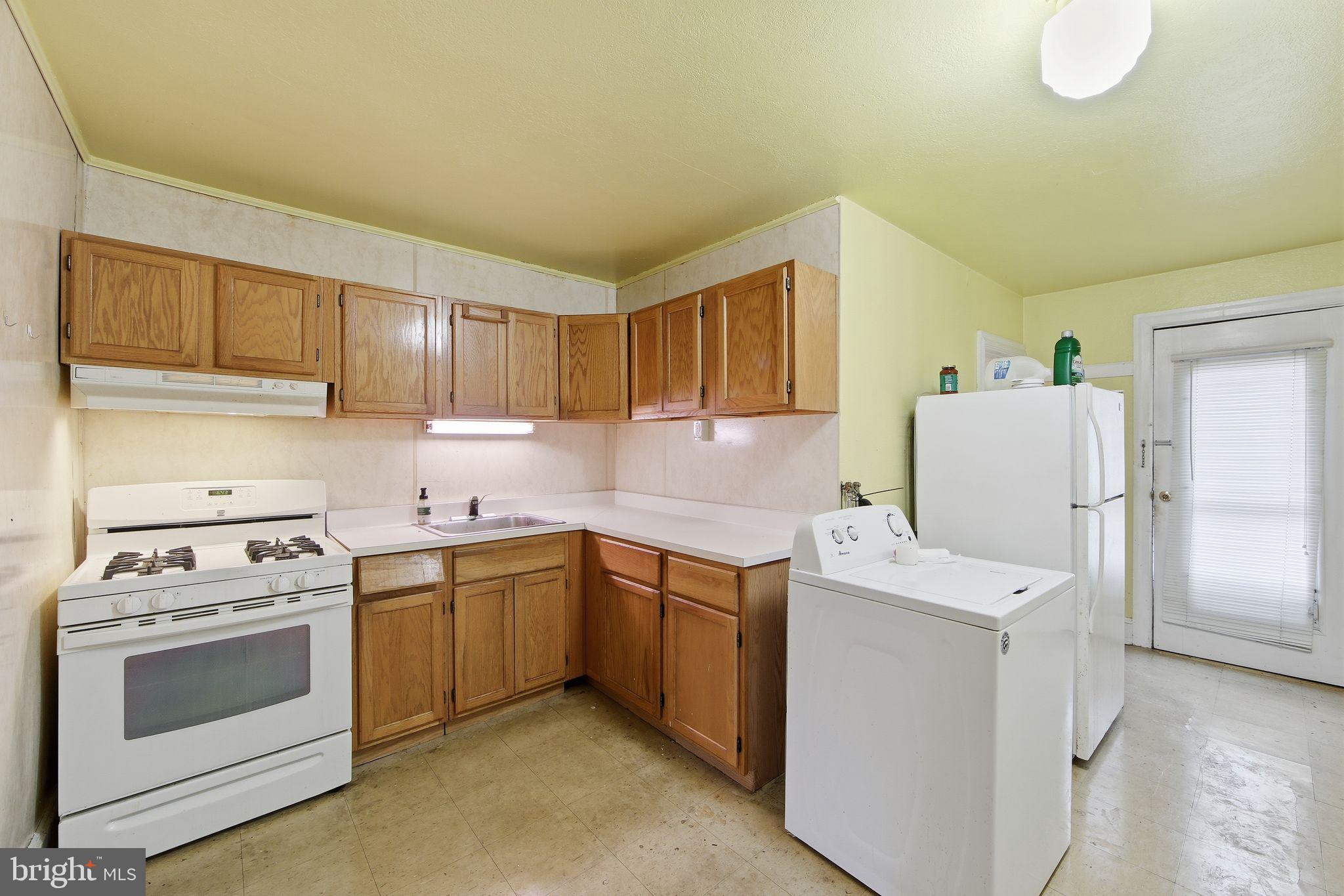 238 Highland Avenue Wayne, PA 19087 - Photo 8 of 17 a kitchen with a stove sink and cabinets