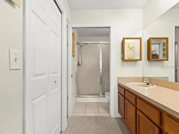 a spacious bathroom with a sink a toilet and shower