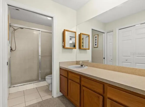 a dining room with furniture and a floor to ceiling window