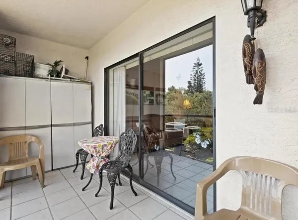 a view of a floor to ceiling window next to a yard