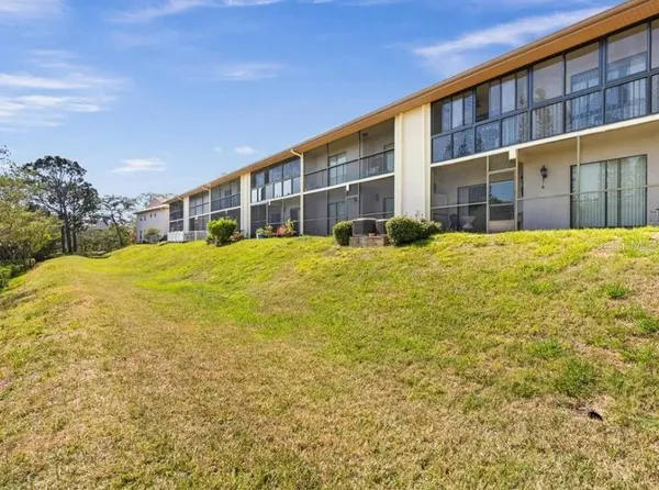 an aerial view of a house with a ocean view