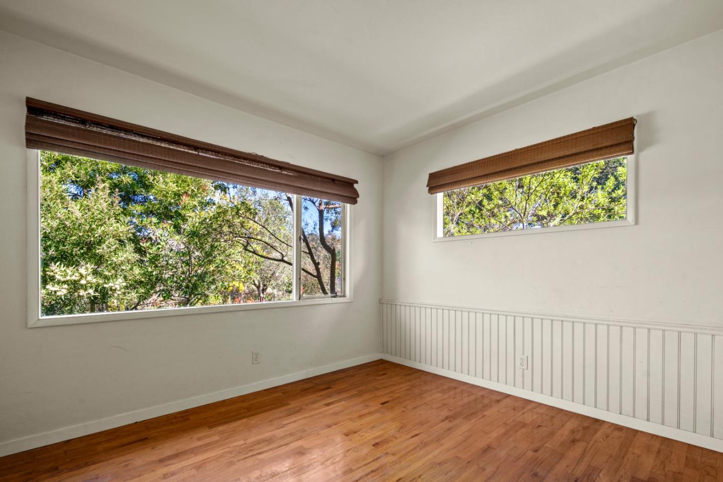 3281 Trevis Way Carmel, CA 93923 - Photo 6 of 16 a view of an empty room with wooden floor and a window