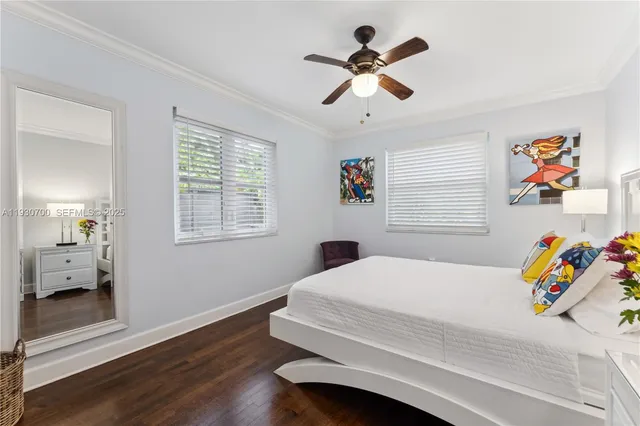 a bedroom with a bed dresser and a window
