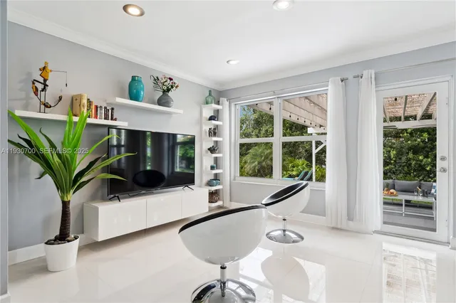 a living room with furniture and a large window
