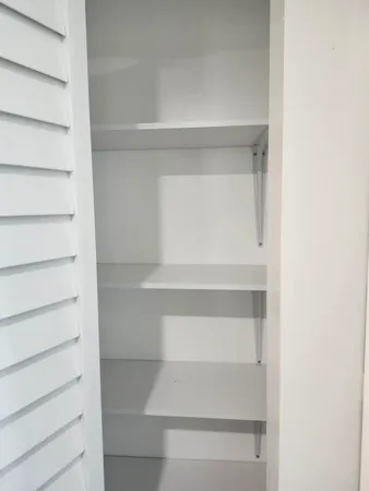 a view of a room with racks on the wall