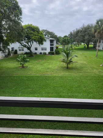 an empty room with wooden floor and closet