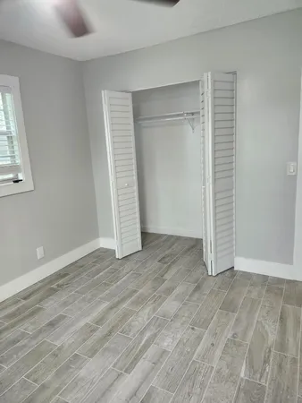 a view of a ceiling fan in a room with a cabinet