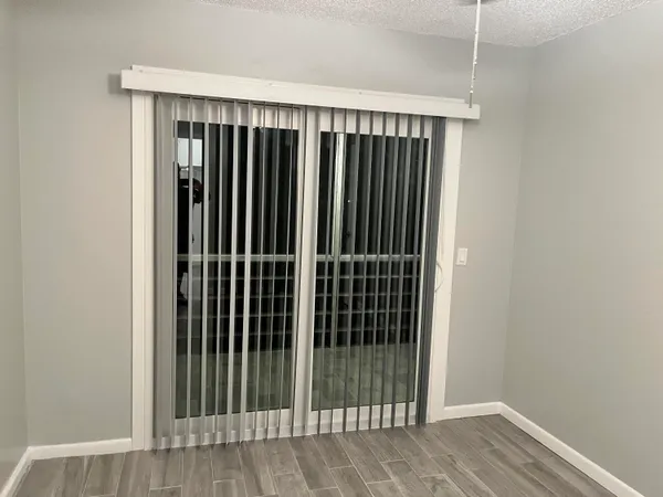 a bathroom with a granite countertop toilet sink and mirror