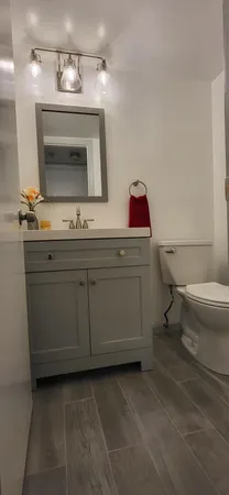 a bathroom with a toilet a sink and a shower
