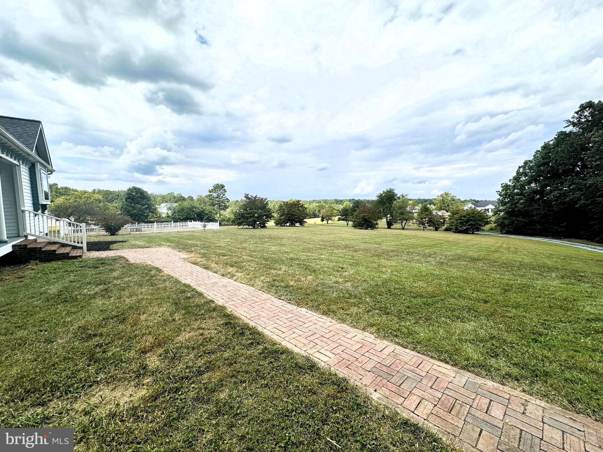 29274 Old Rhoadesville, VA 22542 - Photo 13 of 51 a view of a grassy field with an trees