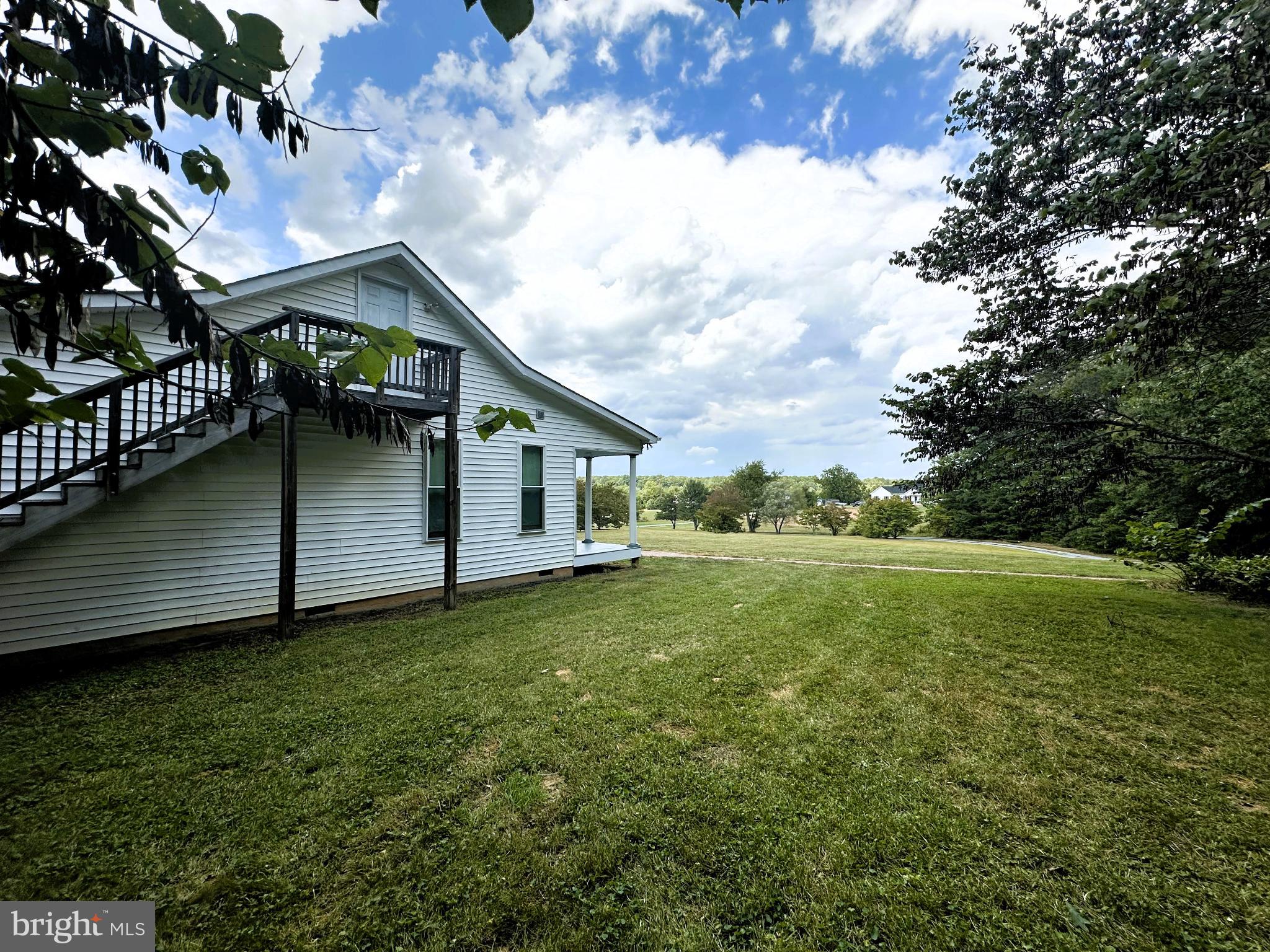 29274 Old Rhoadesville, VA 22542 - Photo 17 of 51 a view of a backyard with plants and large trees