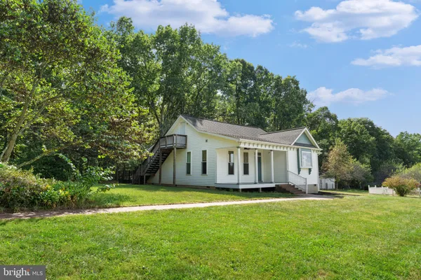 a view of a house with a big yard