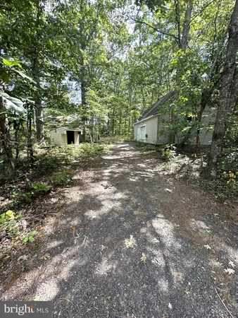 a view of a house with a tree