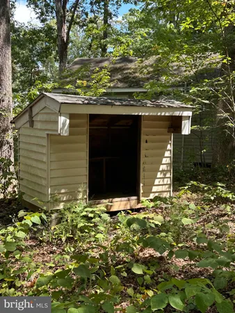 a view of house with yard