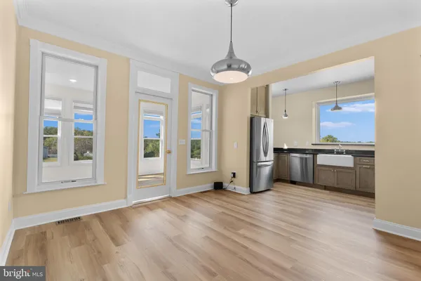 a kitchen with stainless steel appliances a refrigerator and a sink