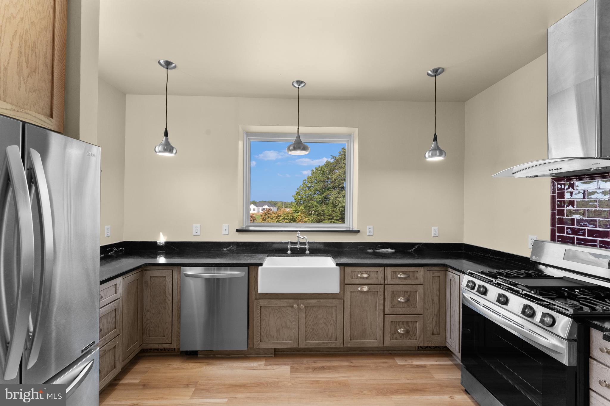 29274 Old Rhoadesville, VA 22542 - Photo 35 of 51 a kitchen with a stove and a refrigerator
