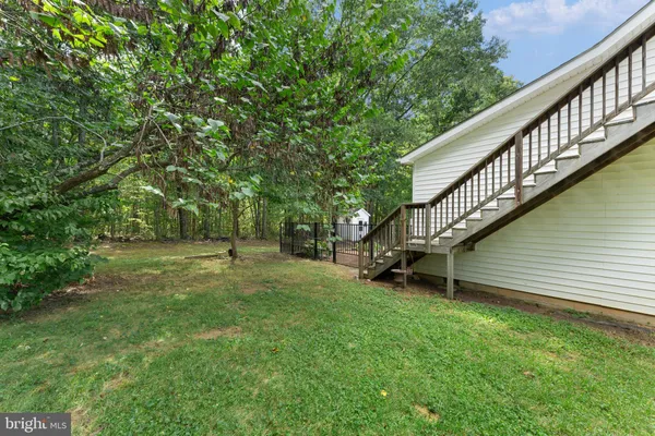 a view of backyard with green space