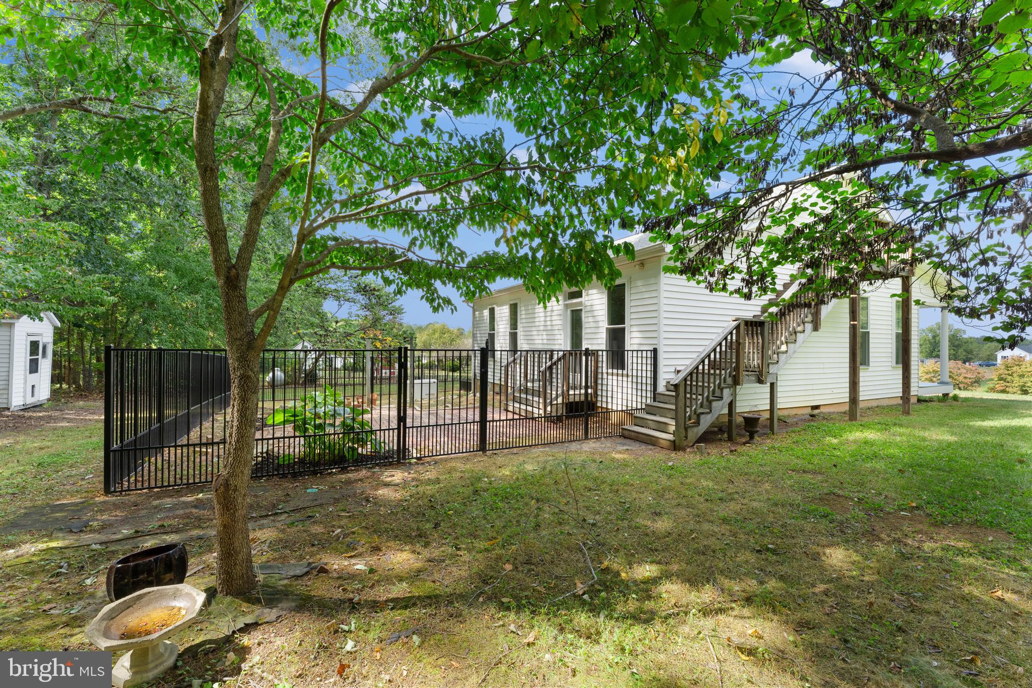 29274 Old Rhoadesville, VA 22542 - Photo 7 of 51 a view of a yard with plants and large trees