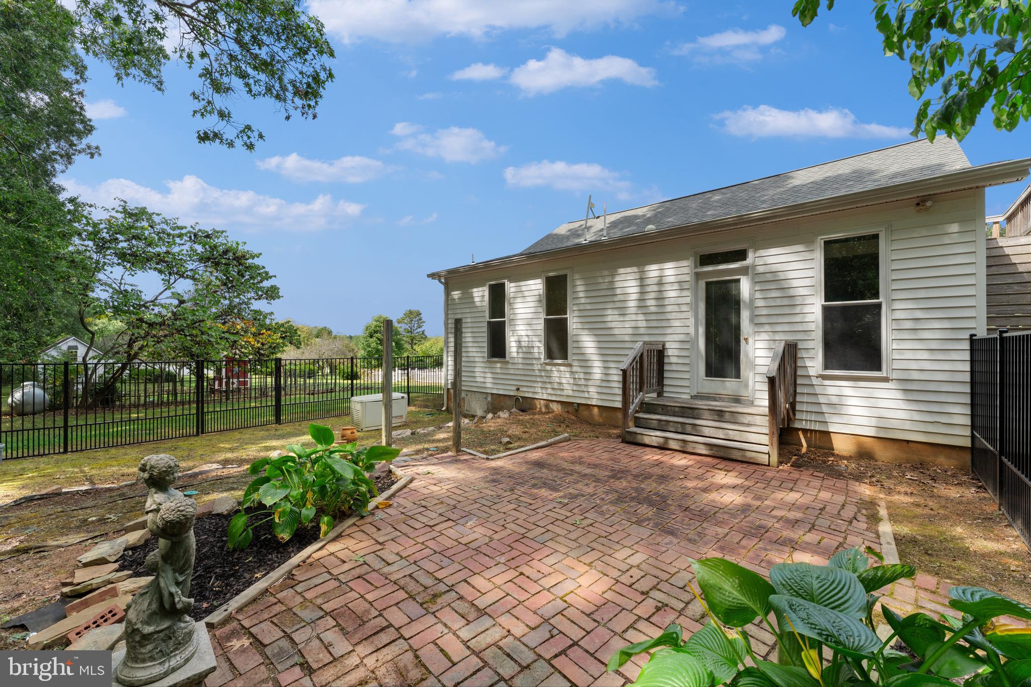 29274 Old Rhoadesville, VA 22542 - Photo 8 of 51 a front view of a house with garden