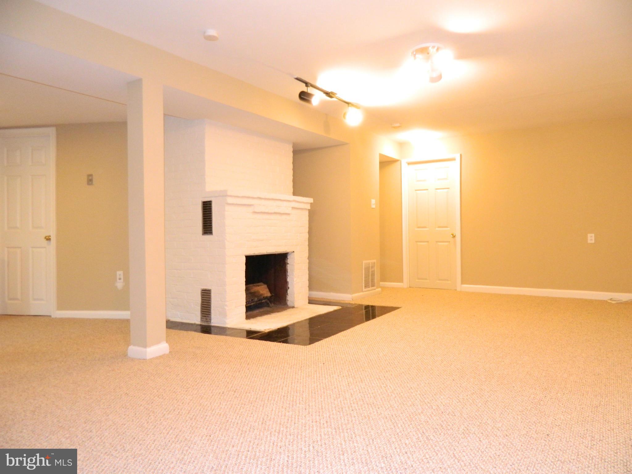 1568 St Margarets Road Annapolis, MD 21409 - Photo 16 of 28 Family Room with Fireplace and New Berber Carpet