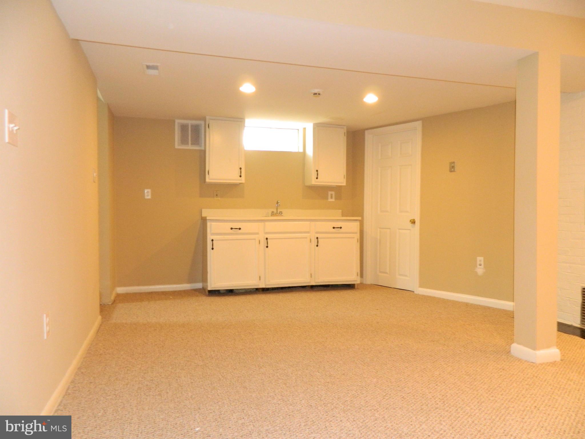 1568 St Margarets Road Annapolis, MD 21409 - Photo 17 of 28 Basement Wet Bar Area with New Berber Carpeting