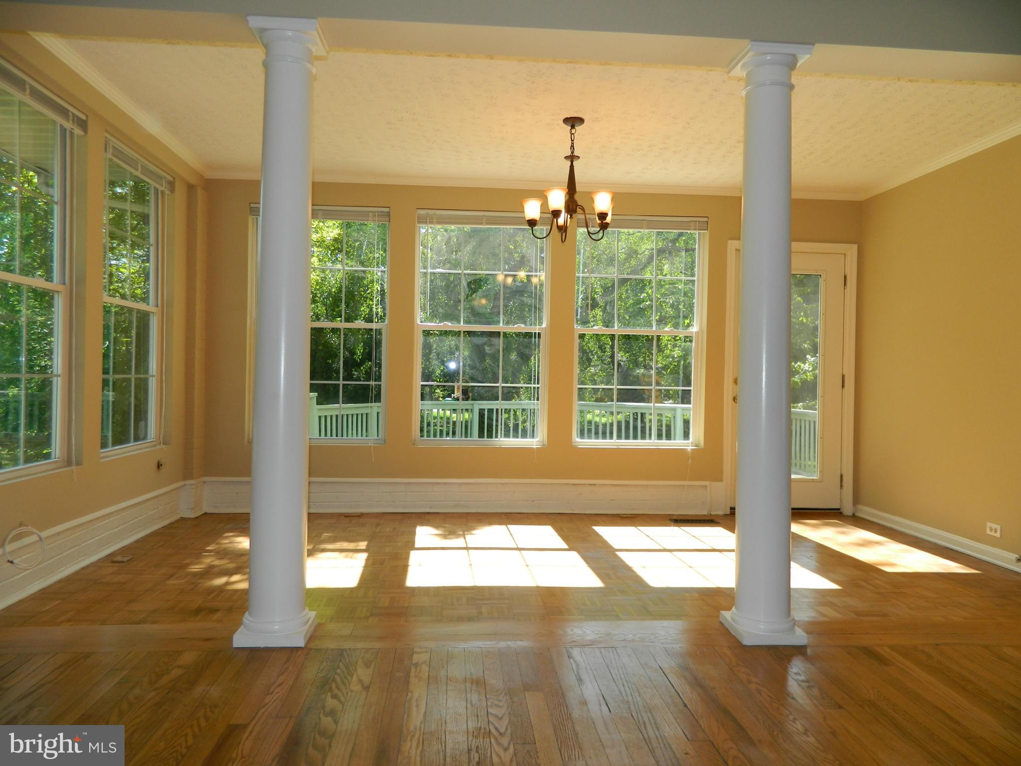 1568 St Margarets Road Annapolis, MD 21409 - Photo 3 of 28 Dining Room with Columns, Wood Floors